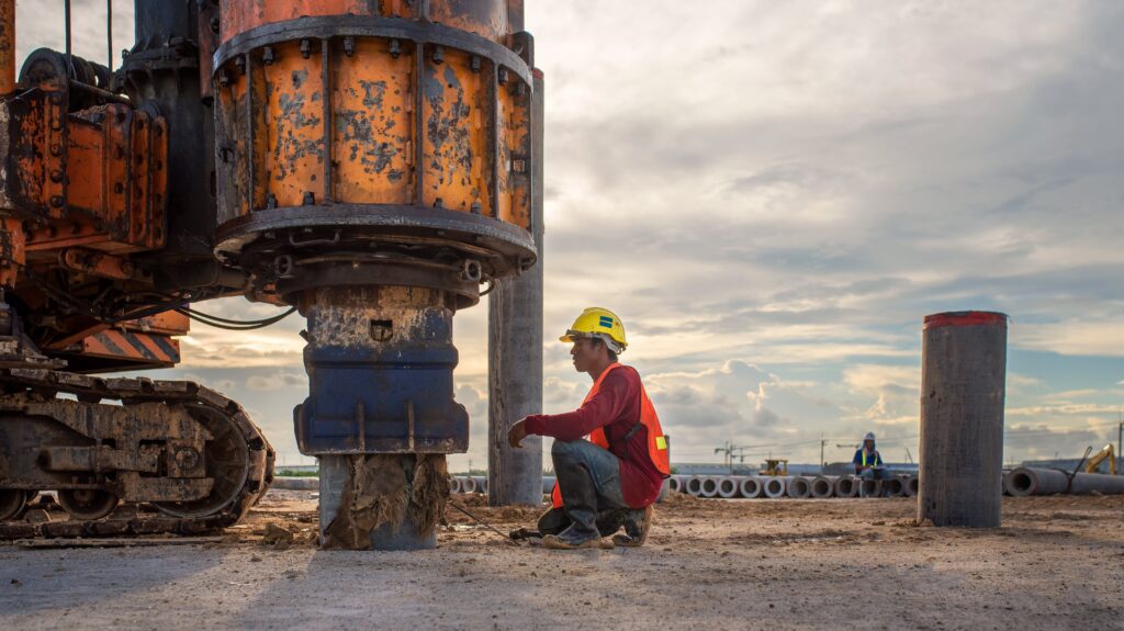 Link Resources mining site safety supervisor MSS S123 G189 worker inspecting drilling equipment on mining site