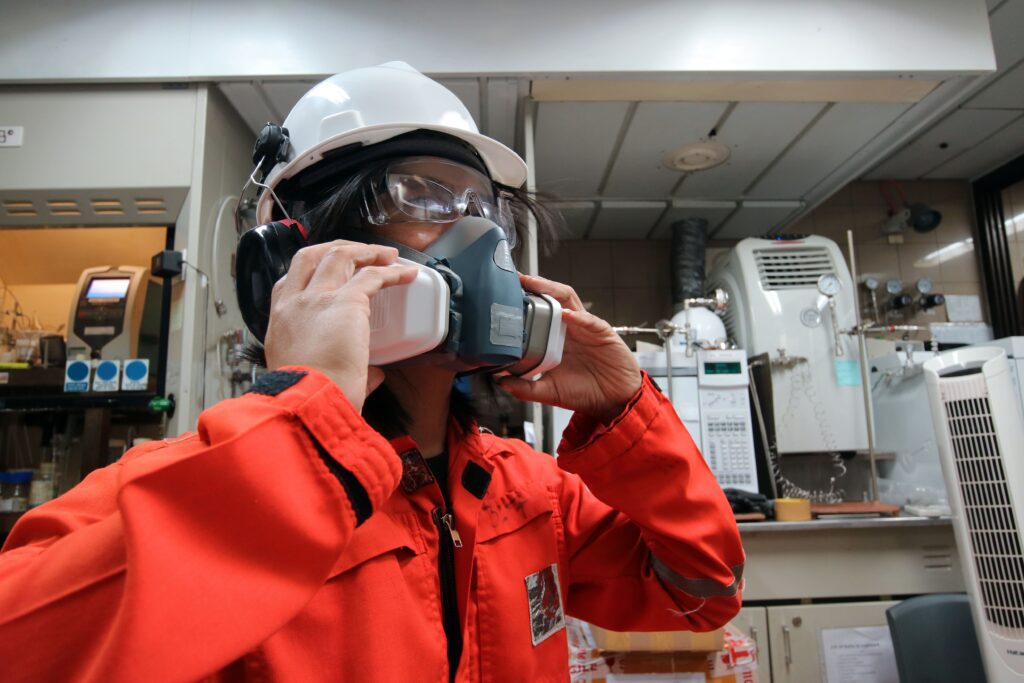 Link Resources breathing apparatus training worker fitting respirator mask in industrial environment