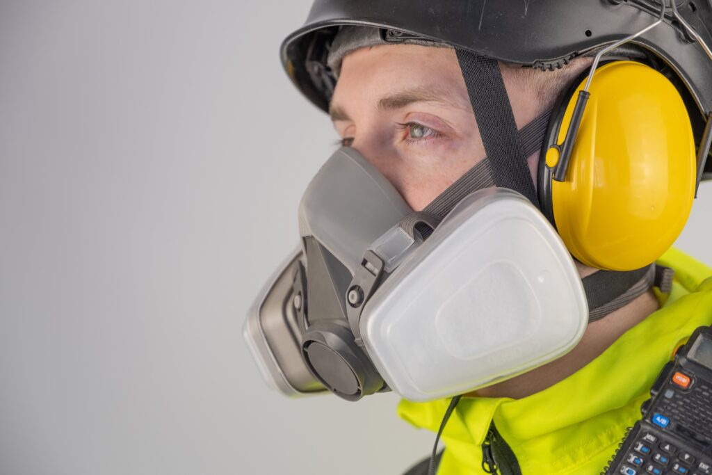 Link Resources breathing apparatus training worker using respirator and hearing protection on worksite