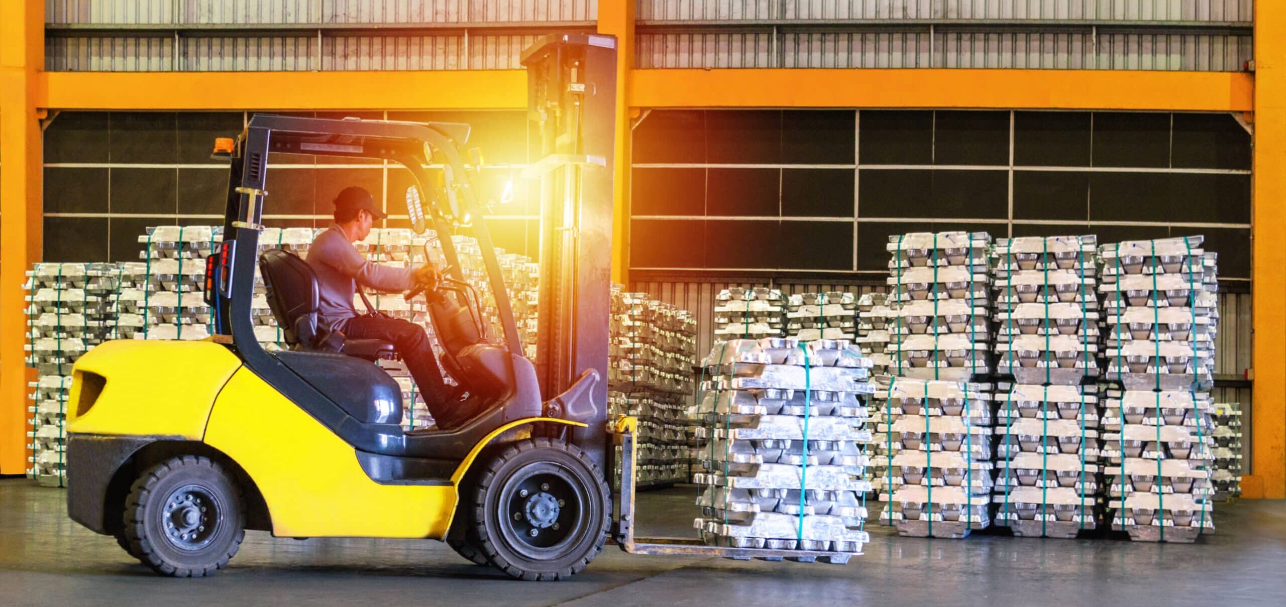 Forklift operator moving palletised goods in warehouse during Link Resources VOC forklift verification of competency assessment
