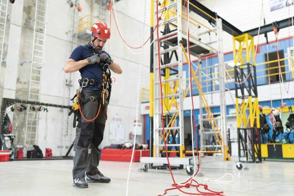 Link Resources working at heights course technician preparing rope access safety equipment